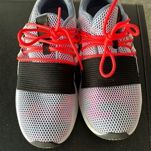 Size 10 Under Armour Sneaker. White, black, bright orange. Just a few times worn